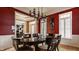 This dining room features hardwood floors, bold paint and decorative trim at 4030 Statesmen Dr, Indianapolis, IN 46250