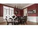 This dining room features hardwood floors, bold paint and decorative trim at 4030 Statesmen Dr, Indianapolis, IN 46250