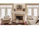 Elegant fireplace flanked by French doors provides a focal point for a cozy living space at 4030 Statesmen Dr, Indianapolis, IN 46250