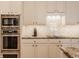 Modern kitchen with stainless steel oven, cooktop, and granite countertops for a sleek look at 4030 Statesmen Dr, Indianapolis, IN 46250