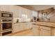 Modern kitchen with granite countertops, stainless steel appliances, and sleek, white cabinetry at 4030 Statesmen Dr, Indianapolis, IN 46250