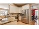 Modern kitchen with stainless steel appliances, granite countertops, and seamless access to dining area at 4030 Statesmen Dr, Indianapolis, IN 46250