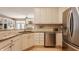 Well-lit kitchen with stainless steel appliances, granite countertops, and open access to living areas at 4030 Statesmen Dr, Indianapolis, IN 46250