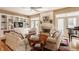 Spacious living room with built-in shelves, a fireplace, and natural light showcases a bright and airy space at 4030 Statesmen Dr, Indianapolis, IN 46250