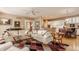 Bright, open-concept living room features a comfortable seating area and seamless flow to the dining and kitchen at 4030 Statesmen Dr, Indianapolis, IN 46250