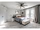 Bedroom with ceiling fan, large windows letting in lots of natural light, and neutral decor at 4350 N College Ave, Indianapolis, IN 46205