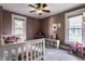 bedroom with twin bed, large windows, and carpeted floors for a cozy feel at 4350 N College Ave, Indianapolis, IN 46205