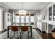 Inviting dining room with modern table and built-in cabinets and seating at 4350 N College Ave, Indianapolis, IN 46205