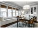 Bright dining area with bench seating and a modern chandelier at 4350 N College Ave, Indianapolis, IN 46205