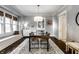 Dining room with a modern table, chandelier, and built-in seating at 4350 N College Ave, Indianapolis, IN 46205
