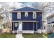Charming two-story home featuring blue siding, white trim, and a well-manicured front yard at 4350 N College Ave, Indianapolis, IN 46205