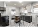 Well-appointed kitchen with island, modern appliances, and classic subway tile backsplash at 4350 N College Ave, Indianapolis, IN 46205