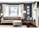 Bright living room features a comfortable gray sofa and fireplace at 4350 N College Ave, Indianapolis, IN 46205