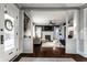 Open-concept living room with hardwood floors, a fireplace, and abundant natural light at 4350 N College Ave, Indianapolis, IN 46205