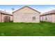 Home with well-maintained lawn, brick exterior and clear blue sky at 5010 Elliott Ave, Indianapolis, IN 46201