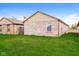 Home with well-maintained lawn, brick exterior and clear blue sky at 5010 Elliott Ave, Indianapolis, IN 46201