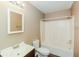 Bright bathroom with vanity, mirror, toilet, and shower tub combination at 5010 Elliott Ave, Indianapolis, IN 46201
