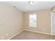 A bedroom with neutral paint, carpet and window providing natural light at 5010 Elliott Ave, Indianapolis, IN 46201