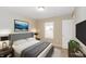 Staged bedroom with headboard, side tables and lamps at 5010 Elliott Ave, Indianapolis, IN 46201