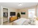 Comfortable bedroom with neutral tones, closet, and natural light at 5010 Elliott Ave, Indianapolis, IN 46201