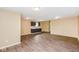 Bright open floorplan features hardwood floors and view of cabinets and sink at 5010 Elliott Ave, Indianapolis, IN 46201