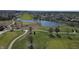 Scenic aerial view of a golf course community with a pond and well-maintained green spaces at 5233 Birmingham Dr, Indianapolis, IN 46235