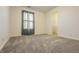 Bedroom with neutral carpet, window and view to the ensuite closet at 5233 Birmingham Dr, Indianapolis, IN 46235