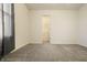 Empty bedroom with plush neutral carpet, window and view to the ensuite closet at 5233 Birmingham Dr, Indianapolis, IN 46235
