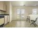 Breakfast nook with access to backyard features neutral tile and chair at 5233 Birmingham Dr, Indianapolis, IN 46235