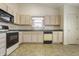 Functional kitchen with neutral-toned cabinets and essential appliances at 5233 Birmingham Dr, Indianapolis, IN 46235