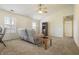 Spacious living area featuring plush carpet, and natural light from multiple windows at 5233 Birmingham Dr, Indianapolis, IN 46235
