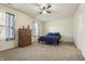 Comfortable bedroom featuring plush carpet, ceiling fan, and dresser at 5233 Birmingham Dr, Indianapolis, IN 46235