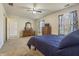 Bedroom with carpet and lots of natural light, featuring dresser and TV at 5233 Birmingham Dr, Indianapolis, IN 46235