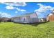 View of the backyard with a deck, showcasing outdoor living space and landscaping at 5737 Misty Ridge Cir, Indianapolis, IN 46237
