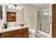 This bathroom features a vanity, mirror, walk-in shower and ample lighting at 5737 Misty Ridge Cir, Indianapolis, IN 46237