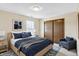 This cozy bedroom features a queen bed, stylish decor and a closet for ample storage at 5737 Misty Ridge Cir, Indianapolis, IN 46237