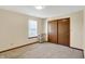 Bright, neutral bedroom with a large closet and natural light from the window at 5737 Misty Ridge Cir, Indianapolis, IN 46237