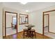 Cozy dining area with a round table and stools adjacent to a kitchen space at 5737 Misty Ridge Cir, Indianapolis, IN 46237
