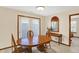 Cozy dining area with a wooden table, chairs, and natural lighting at 5737 Misty Ridge Cir, Indianapolis, IN 46237