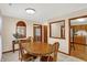 Inviting dining area with a wooden table set and an open view to the kitchen at 5737 Misty Ridge Cir, Indianapolis, IN 46237