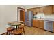 Eat in kitchen with stainless steel appliances and light colored countertops at 5737 Misty Ridge Cir, Indianapolis, IN 46237