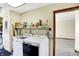 Bright laundry area features modern washer and dryer units with convenient shelving for supplies at 5737 Misty Ridge Cir, Indianapolis, IN 46237