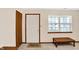 Neutral living room featuring new carpeting, and large windows with decorative wooden trim at 5737 Misty Ridge Cir, Indianapolis, IN 46237