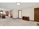 Inviting living space with neutral walls and carpeting, with an adjacent dining area at 5737 Misty Ridge Cir, Indianapolis, IN 46237