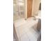 A functional bathroom with an enclosed shower, toilet, and tile flooring, ready for a refreshing update at 5949 Willow Bend Dr, Avon, IN 46123