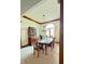 Well-lit dining room with beautiful wood table, chairs, and hutch at 5949 Willow Bend Dr, Avon, IN 46123