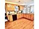 Spacious kitchen with wooden cabinets, granite countertops, and stainless steel appliances at 5949 Willow Bend Dr, Avon, IN 46123