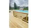 Backyard pool with wooden deck and lounge chairs for relaxing poolside at 5949 Willow Bend Dr, Avon, IN 46123