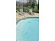 Inground pool with lounge chairs and steps for easy access at 5949 Willow Bend Dr, Avon, IN 46123