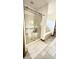 A streamlined shower with glass doors, complemented by a plush white rug and easy access to the bathtub at 5949 Willow Bend Dr, Avon, IN 46123